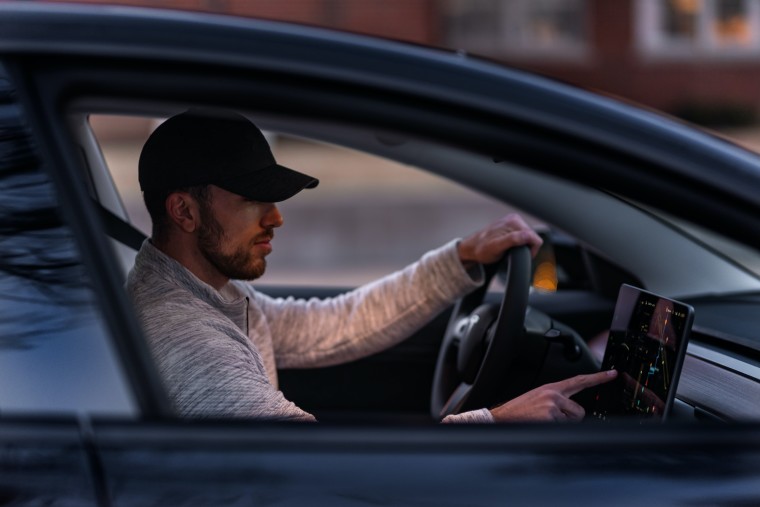 1684056008_man_inside_tesla_car_story.jpg